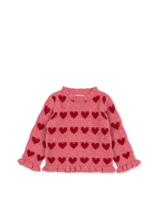 Konges Sløjd Laula Sweater Heart – różowy sweter z rzędami czerwonych serc i delikatnymi falbankami przy mankietach, pokazany w całości.
