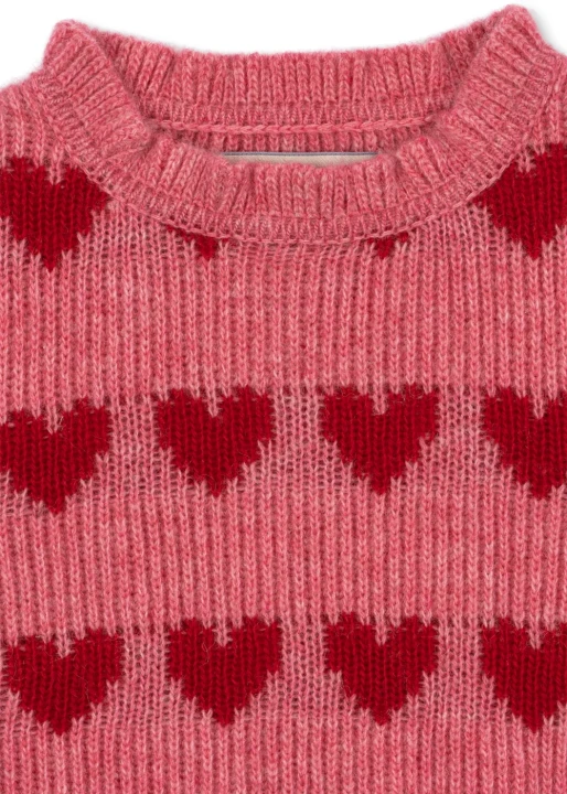 Laula Sweater Heart – detal wykończenia dekoltu i regularnie rozmieszczonych serc w górnej części swetra.