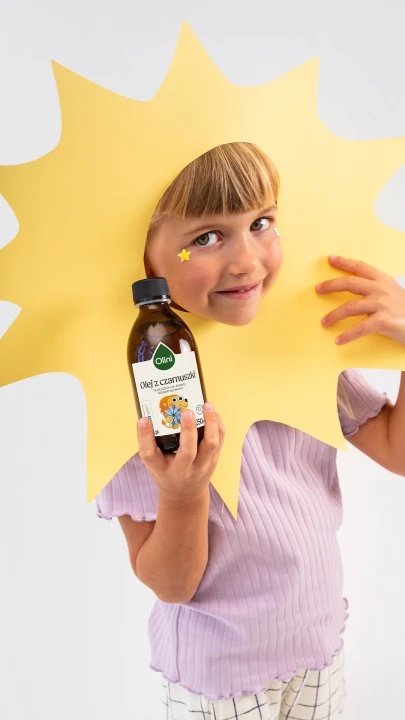 Olini olej z czarnuszki z lwem 250 ml, butelka i motyw lwa