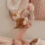 Little Dutch Ring Rattle Pink Fairy Garden – zbliżenie grzechotki w dłoni