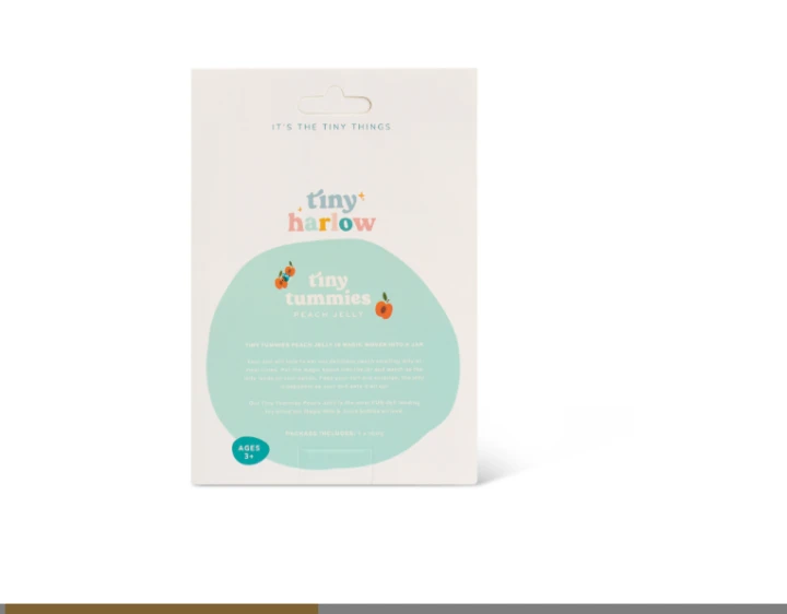 Tiny Harlow Tiny Tummies ilustracja brzoskwini na opakowaniu