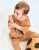 luu-kids-smoczek-milk-hazelnut-niemowle-na-rekach