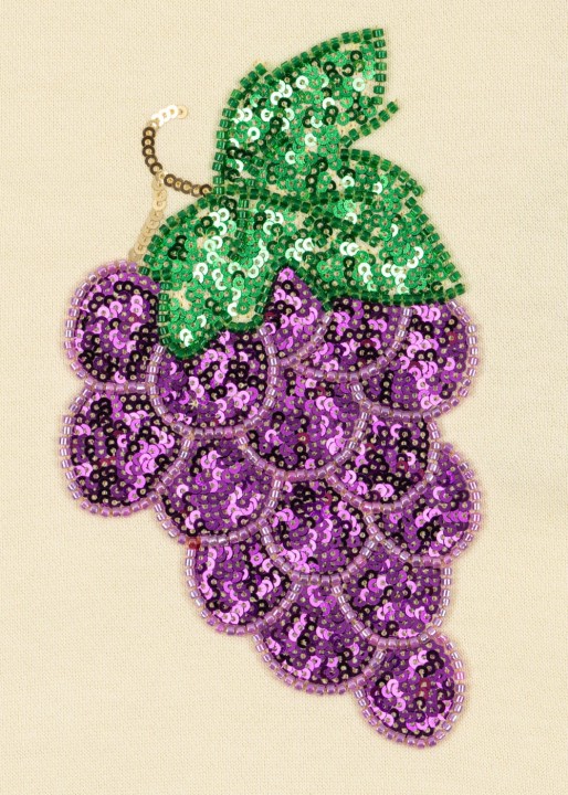 Detal bluzy Konges Sløjd Lou Sequin z bawełny organicznej.