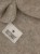Detal kominiarki HUTTEliHUT Balaclava Ears Wool Fleece - wełniany materiał Savannah Melange i metka marki