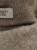 Detal bucików HUTTEliHUT Footies Wool Fleece - wełna merino Savannah Melange, mankiet i metka marki