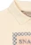 Spotty Buttercream – kołnierzyk polo i fragment nadruku