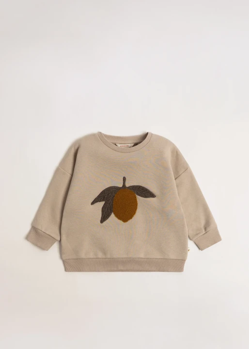 Konges Sløjd Lou Terry Oxford Tan Lemon – beżowa bluza dziecięca z aplikacją cytryny
